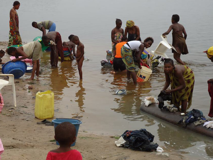 Picture of Women and Children Using a Dirty Water Source