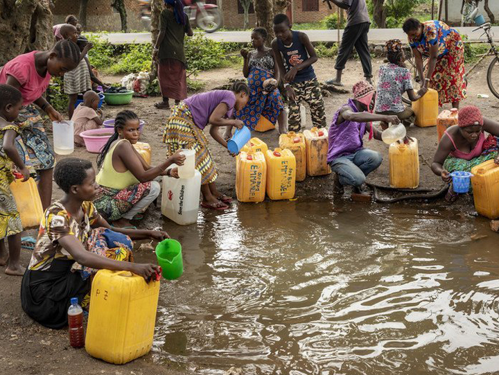 Picture of Women and Children Using unsafe Water Source
